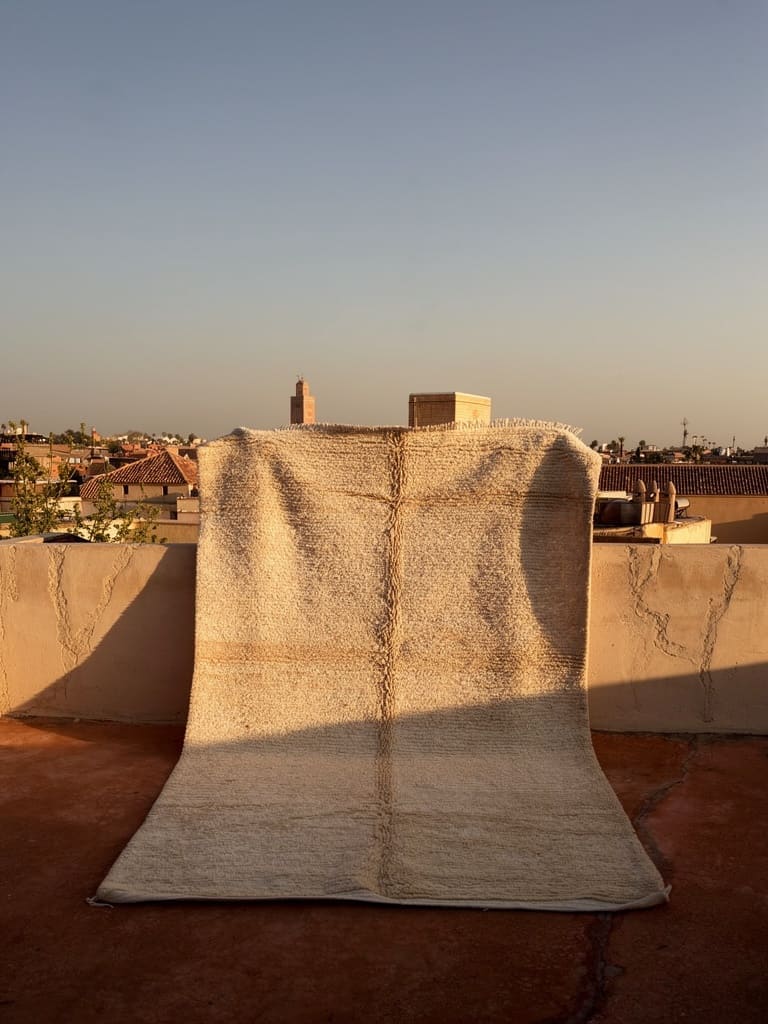 A weaver on a rooftop in the Atlas mountains